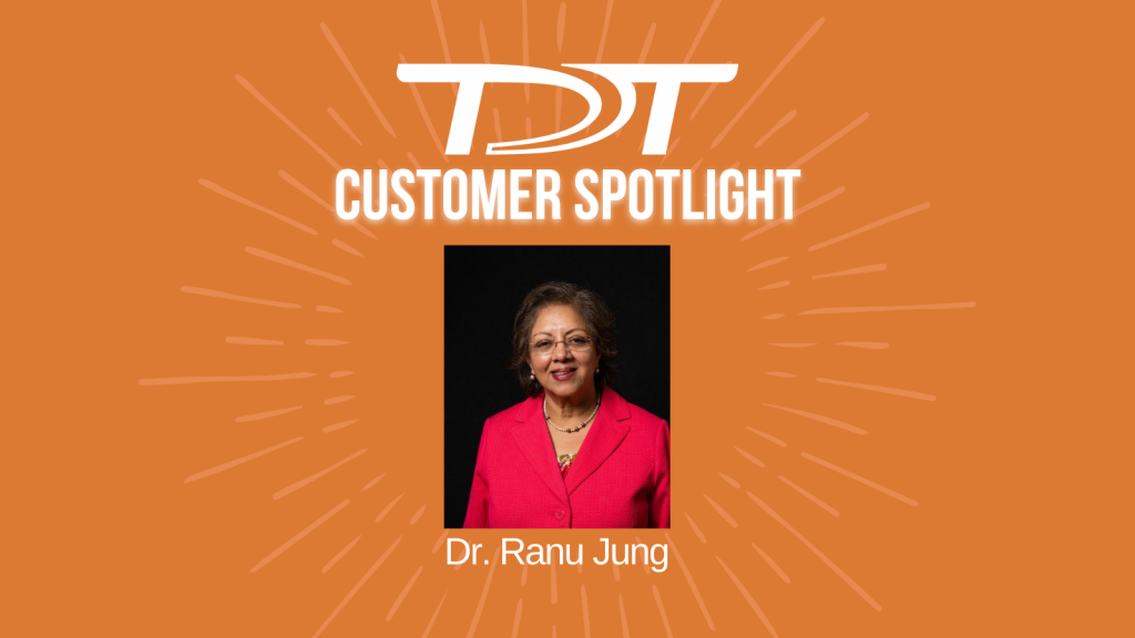 Images of Dr. Jung on an orange starburst background with the text in white "TDT Customer Spotlight" and her name underneath.